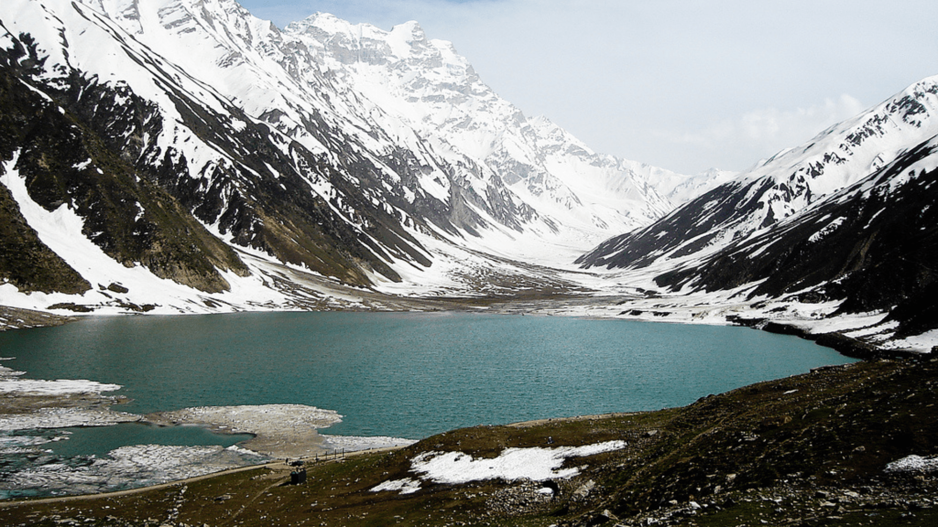 Majestic mountain peaks under a clear blue sky in northern Pakistan.