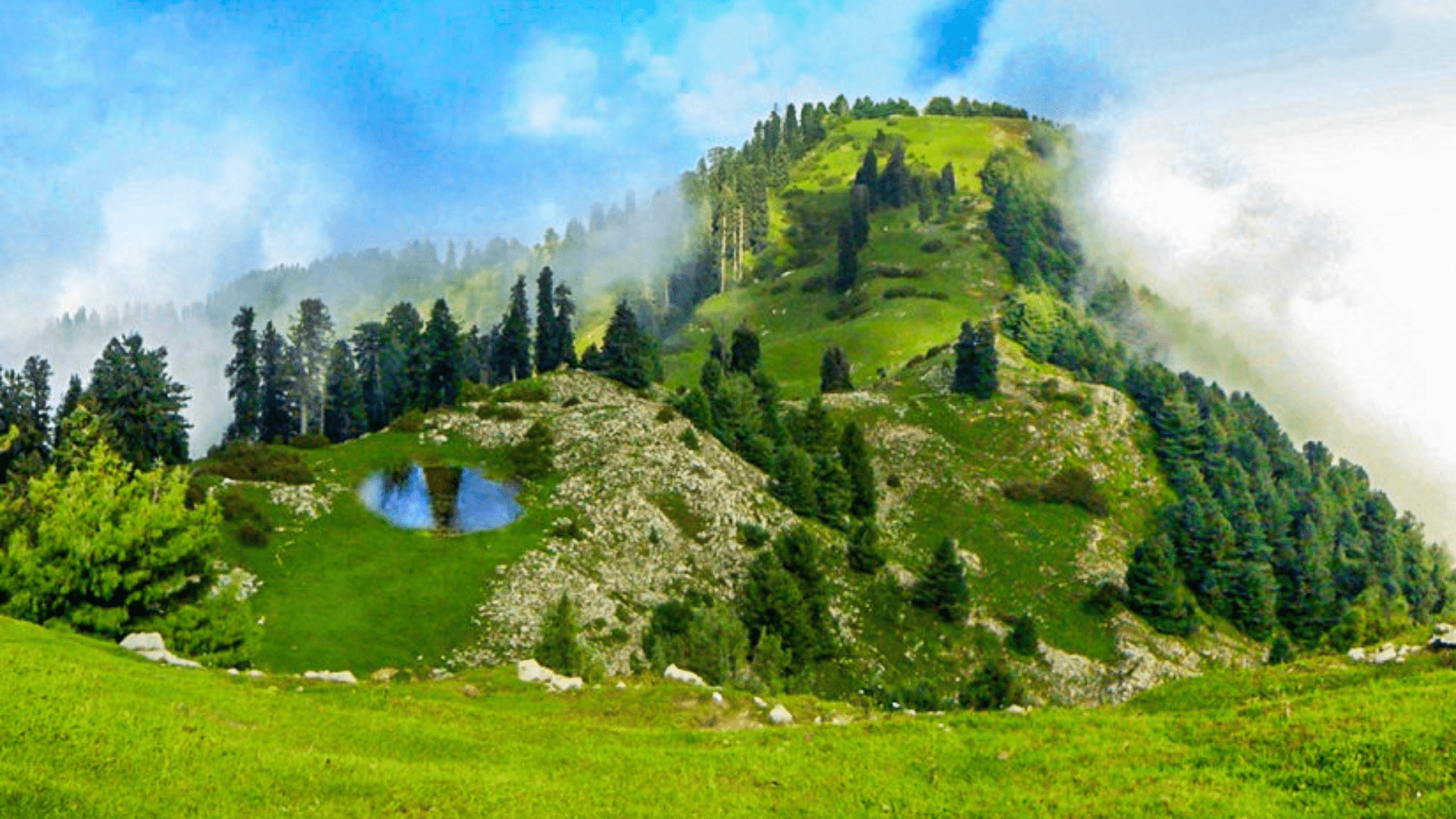 Majestic mountain peaks under a clear blue sky in northern Pakistan.