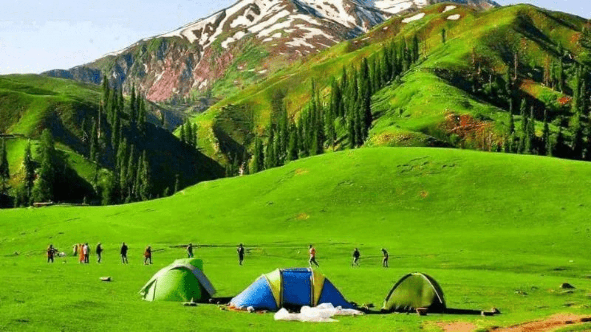 Majestic mountain peaks under a clear blue sky in northern Pakistan.