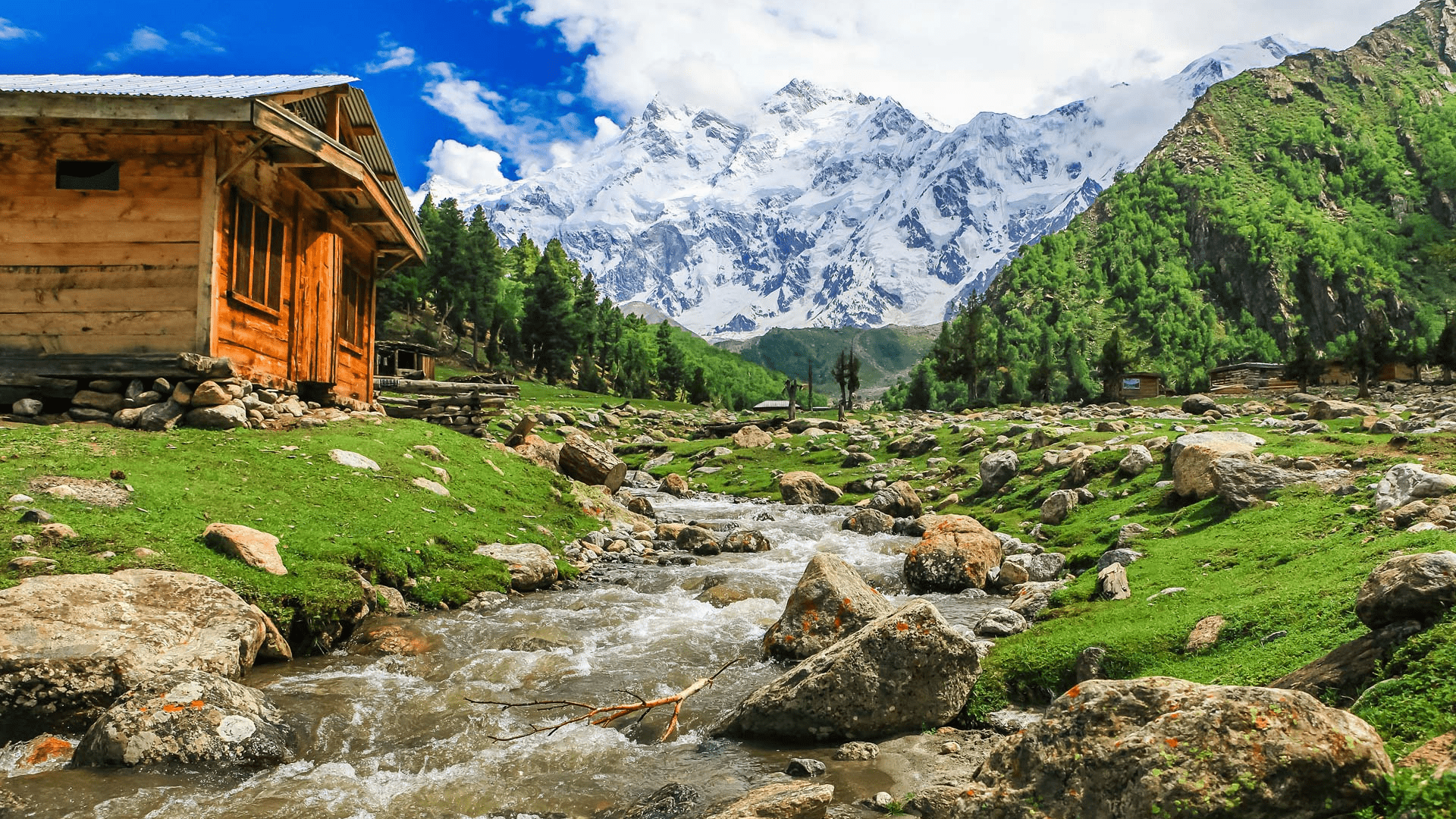 Majestic mountain peaks under a clear blue sky in northern Pakistan.